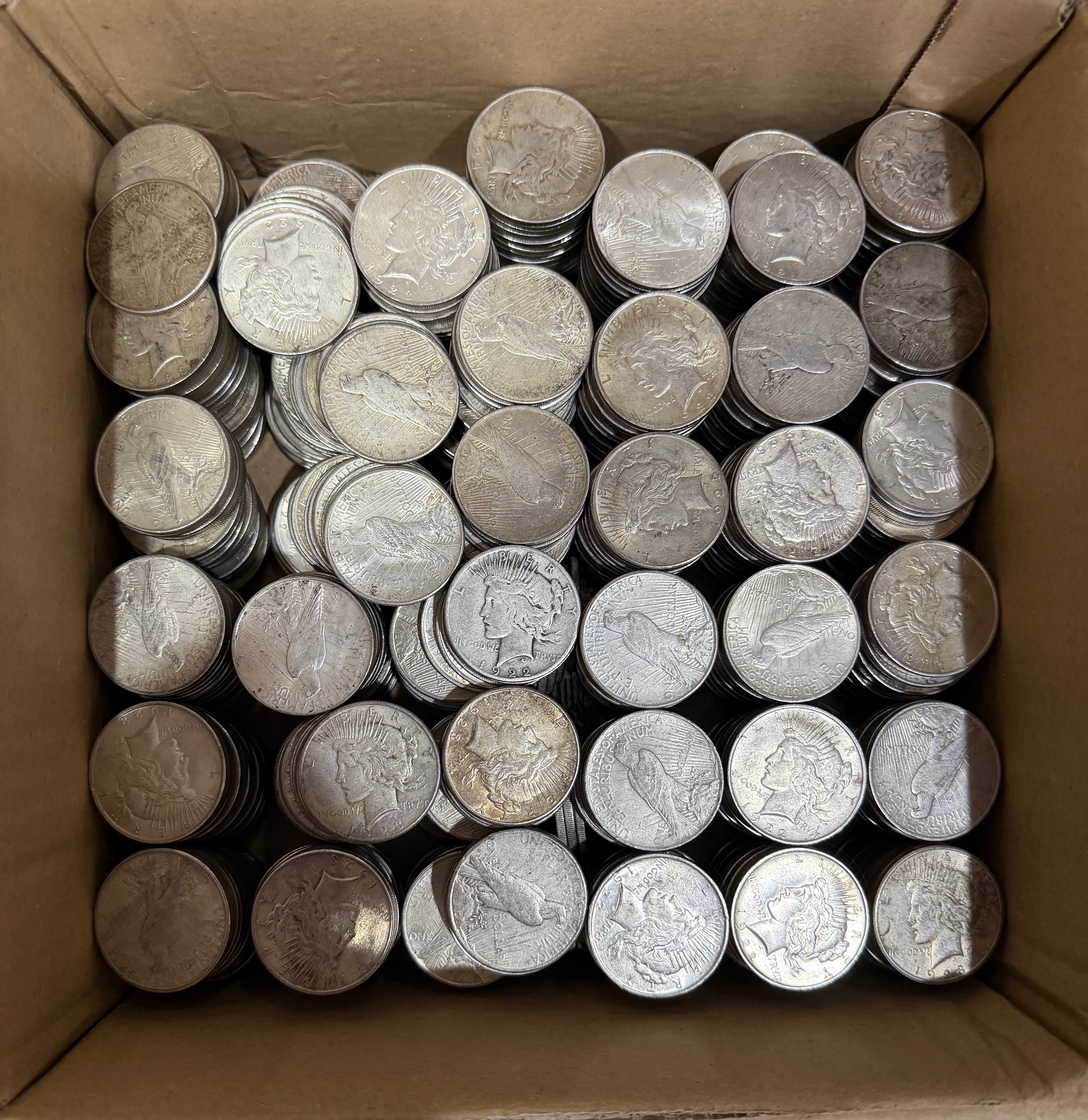 Large box filled with Peace Silver Dollars purchased by Clemson Coins in June 2026