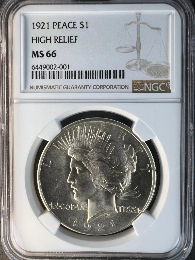 1921 Peace Dollar High Relief Philadelphia NGC MS66 obverse in NGC slab: Liberty head facing right with radiant crown, LIBERTY above, IN GOD WE TRVST below, date 1921 at bottom, blast white frosty surfaces with exceptional cartwheel luster, NGC label reading 1921 PEACE $1 HIGH RELIEF MS 66, cert 6449002-001